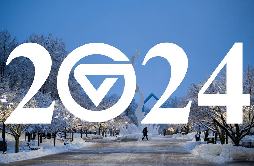 2024 superimposed over photo of student walking on the snowy campus.